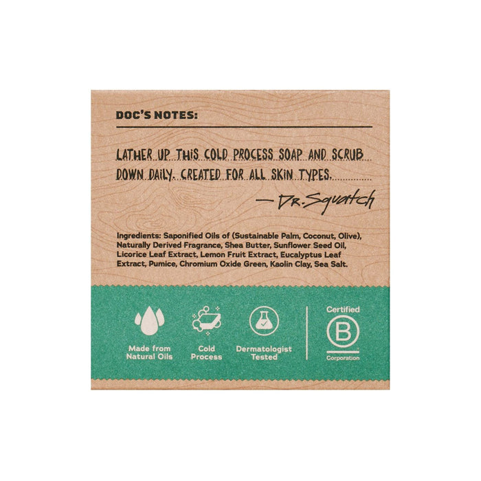 Dr. Squatchs Mens Bar Soap label displays its beige and green color scheme and highlights dermatologist testing, suitability for all skin types, natural oils, and cold processing with ingredient details and certification icons for everyday use.