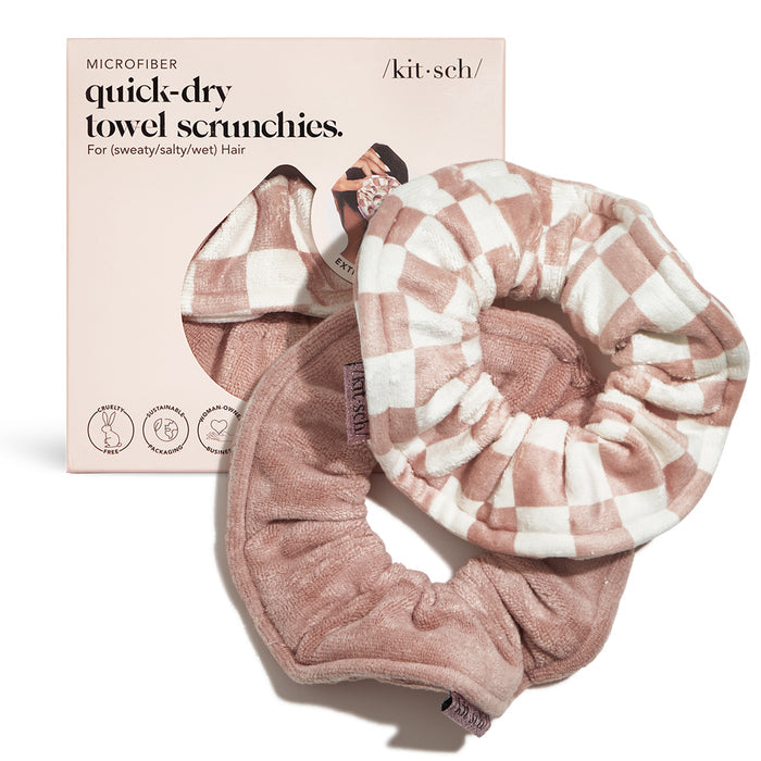 The package includes two pink Kitsch Microfiber Quick-Dry Towel Scrunchies, featuring a checkered and plain designs. The box highlights ultra absorbent and soft microfiber, making them perfect for sweaty, salty, or wet hair post-shower routines.