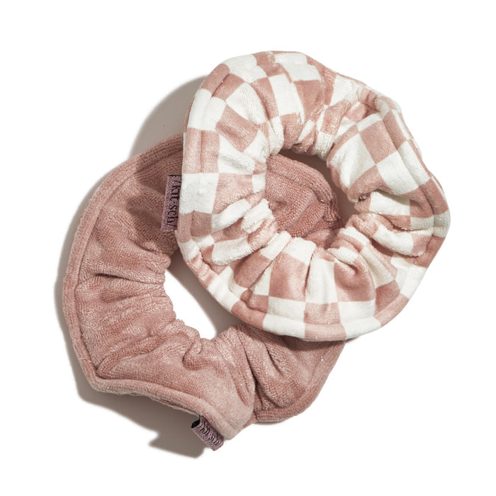 Two Kitsch Microfiber Quick-Dry Towel Scrunchies, one plaid pink and the other solid pink, lie overlapping on a white background. Ideal for post-shower routines, they combine style and absorbent functionality.