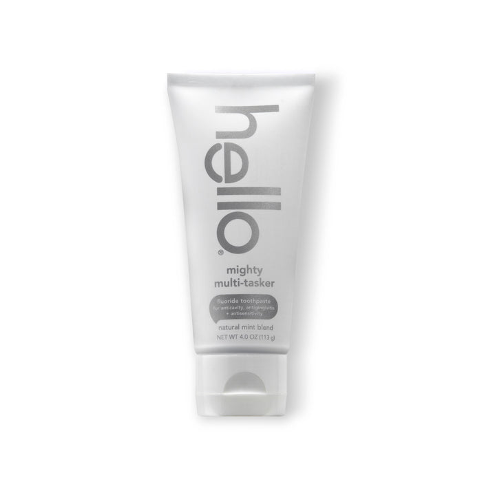 The hello Mighty Multi-Tasker Multi-Benefit Fluoride Toothpaste offers a natural mint blend for fresh breath and promises to strengthen enamel and whiten teeth. Its sleek white tube on a crisp white background highlights its clean, refreshing appeal.
