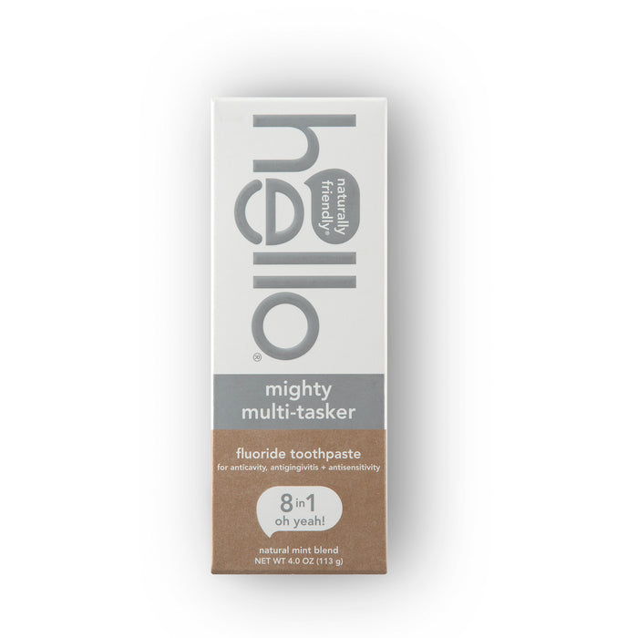A tall, mostly white hello box with brown accents holds Mighty Multi-Tasker Multi-Benefit Fluoride Toothpaste. It features natural mint flavor and benefits like cavity prevention, sensitivity relief, enamel strengthening, and natural whitening for fresh breath.