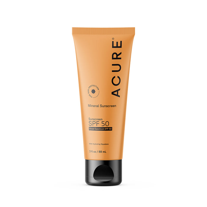 A 3 fl oz (88 ml) orange tube of Acure Mineral Sunscreen - SPF 50 with a black cap, featuring squalane and zinc oxide for broad spectrum protection, stands upright on a white background.
