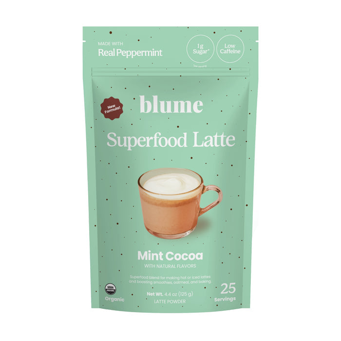 The blume Mint Cocoa Blend, in mint green packaging, offers a frothy hot chocolate infused with real peppermint and maca. With low sugar and caffeine, this superfood latte supports digestion and provides 25 servings of organic goodness.