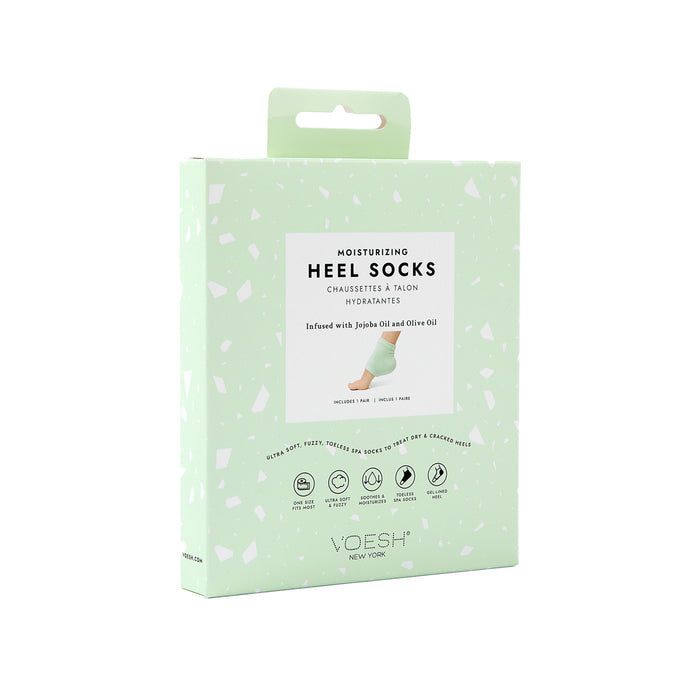 A mint green box of VOESH New York Moisturizing Heel Socks is set against a plain white backdrop, emphasizing its luxurious infusion with jojoba and olive oils.