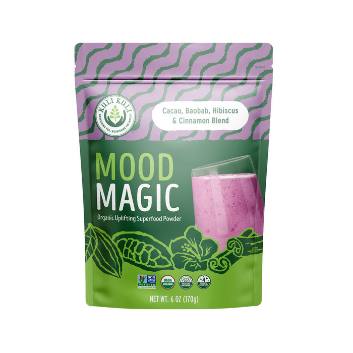 Introducing Kuli Kuli Foods Mood Magic Organic Superfood Blend, packaged in a vibrant design featuring a pink smoothie. Adorned with cacao, baobab, and hibiscus images, it is accented with green and purple leaves. Net weight: 6 oz (170g).