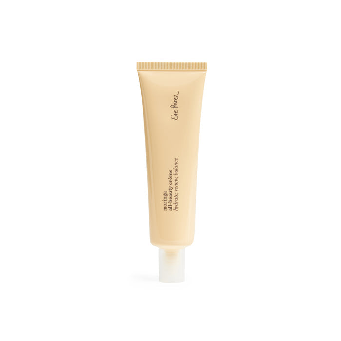 A beige tube with a white cap stands upright, featuring En Her, and denotes its the Moringa All-Beauty Crème, a mattifying emulsion by Ere Perez. The simple design highlights a clean aesthetic on a white background, making it ideal for any skincare routine.
