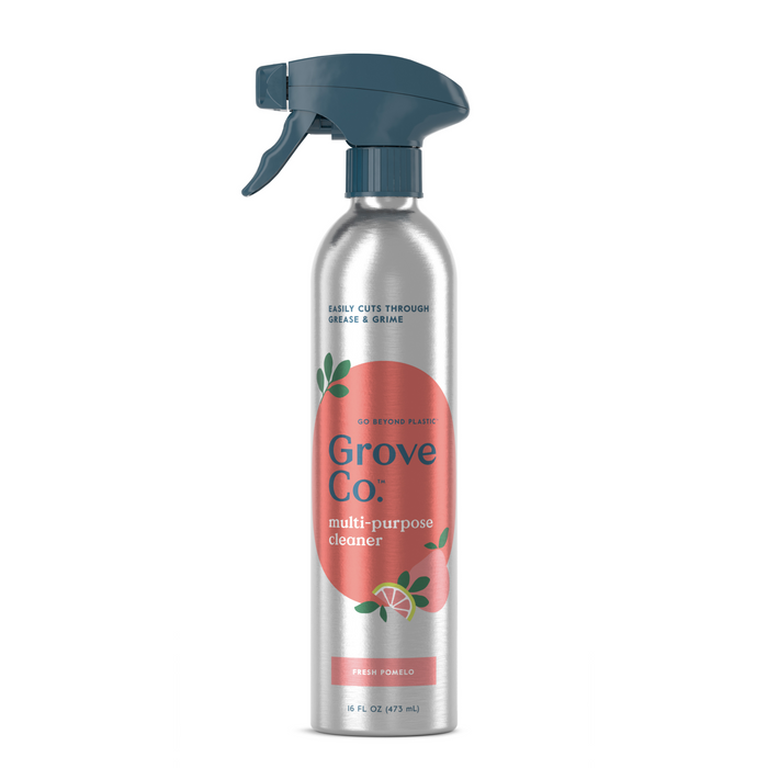 The Grove Co. Multi-Purpose Cleaner comes in a recyclable 16 FL OZ (473 mL) aluminum spray bottle with a blue trigger and sleek design. Featuring a pink label with green graphics, it offers a Fresh Pomelo scent and effectively tackles household grease and grime.