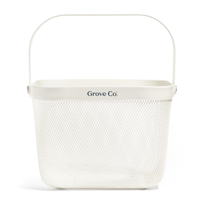 White rectangular metal caddy with mesh wire design and top handle, labeled Grove Co. Product name: Multi-Purpose Mesh Basket.