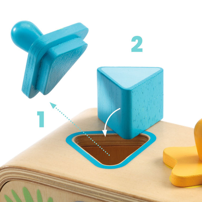 A blue, triangular wooden shape is about to be placed into a matching triangular hole on a toy box. The hole is outlined in blue. The image includes arrows and numbers indicating the sequence of actions.
