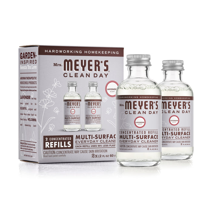 Box of Mrs. Meyers Multi-Surface Concentrate Refills includes two glass lavender-scented refills, showcasing garden-inspired scents and essential cleaning solutions.