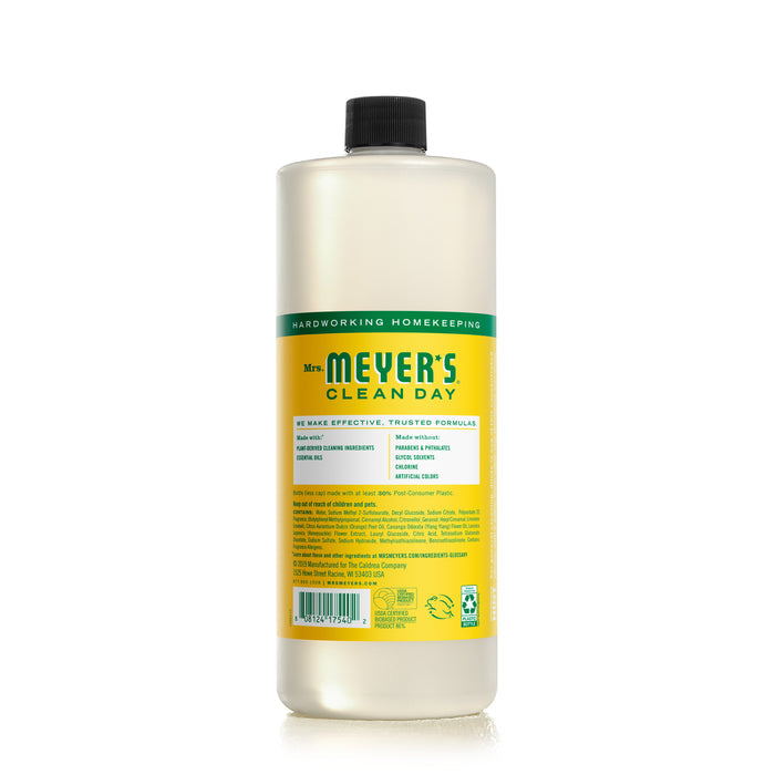 Mrs. Meyers Multi-Surface Concentrate, with a yellow label and black cap, offers an eco-friendly cleaning solution infused with essential oils. The slightly translucent bottle ensures your dishes are left sparkling clean.