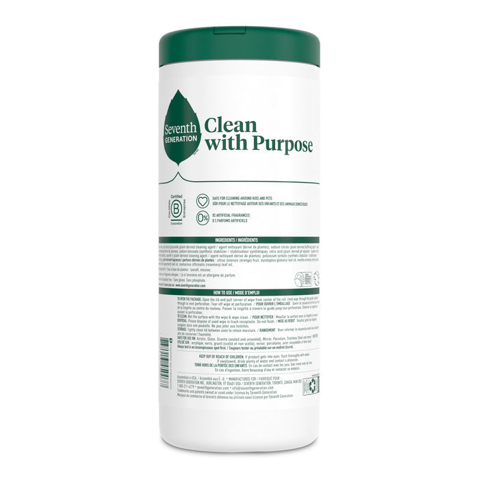 A cylindrical container with a green lid features Clean with Purpose and Seventh Generation. It holds Multi-Surface Wipes infused with essential oils, offering a refreshing garden mint scent, along with environmental logos and detailed product information.