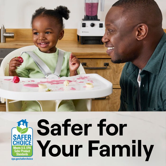 A smiling child in a high chair with food sits next to a smiling adult. On the counter behind them are a blender and Seventh Generation Multi-Surface Wipes. Text reads Safer for Your Family featuring a Safer Choice label indicating EPA standards.