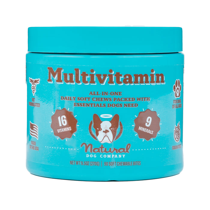 A turquoise jar features Natural Dog Company’s Multivitamin for Dogs, with a dog face illustration. Offering immune support, it contains 16 vitamins and 9 minerals. Labels include Daily Soft Chews, Not Sedated, Made in the USA, Grain-Free. Includes 90 soft chewable bites.