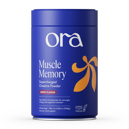 A blue cylindrical container of Ora Organic Muscle Memory: Supercharged Creatine Powder, Berry Flavor, with orange accents. The vegan, Informed Sport certified creatine monohydrate supports strength, energy, recovery, and cognition. 30 servings.