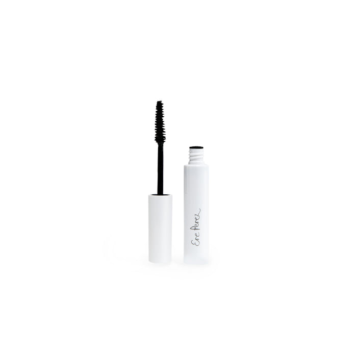 An open tube of Ere Perez Natural Almond Mascara with a black wand is showcased against a white background, revealing its smudge-proof magic.