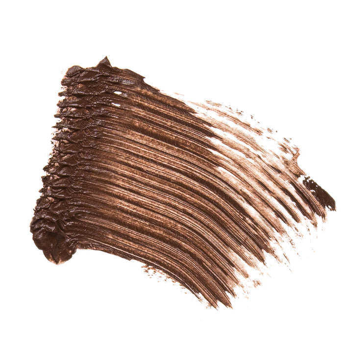 A rich, creamy coat of Ere Perezs Natural Almond Mascara is displayed on a white background. Enhanced with almond oil, its smooth and even texture shows subtle brush strokes indicating a smudge-proof finish.