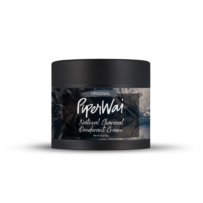 The PiperWai Natural Deodorant Cream features a sleek black container with a smoky design and highlights its original formula. Infused with activated charcoal and skin-conditioning ingredients, it provides a refreshing 2 oz (60g) experience.