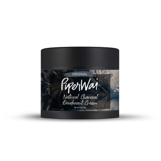 The PiperWai Natural Deodorant Cream features a sleek black container with a smoky design and highlights its original formula. Infused with activated charcoal and skin-conditioning ingredients, it provides a refreshing 2 oz (60g) experience.