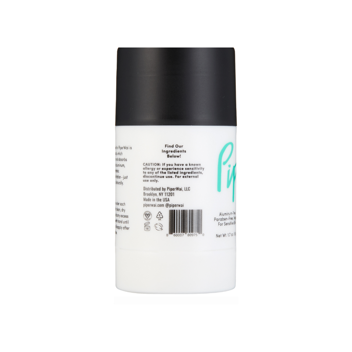 The PiperWai Natural Deodorant Stick features a sleek cylindrical design with a white body, black cap, branding label, ingredient details like activated charcoal, caution info, recycling symbols, and the brands Brooklyn, NY location.