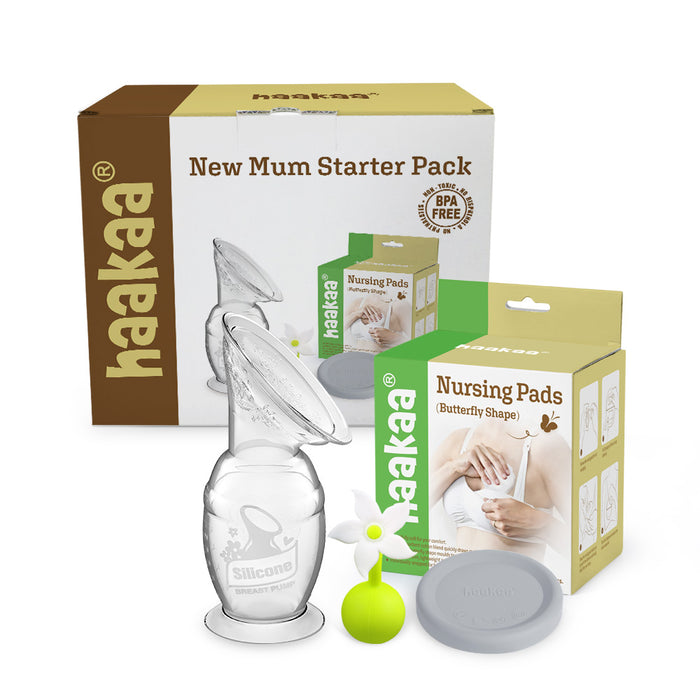 Image of Haakaas New Mom Starter Pack featuring a silicone breast pump with a flower stopper, gray lid, and butterfly-shaped disposable breast pads. The items are elegantly arranged in front of their packaging.