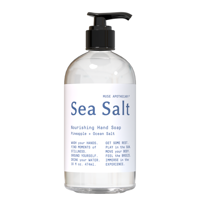 The Sea Salt Nourishing Hand Soap by Muse Apothecary comes in a clear 16 fl oz (474 ml) pump bottle. Its infused with pineapple and ocean salt, featuring wellness messages about self-care, inviting you to a tropical escape with each wash.