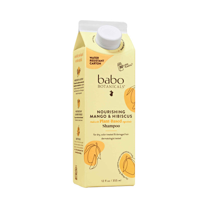 Babo Botanicals Nourishing Shampoo for Dry, Damaged Hair comes in a 12 fl oz (355 ml) water-resistant, eco-friendly carton with mango and hibiscus designs. It is enriched with mango butter, suitable for dry, color-treated hair.