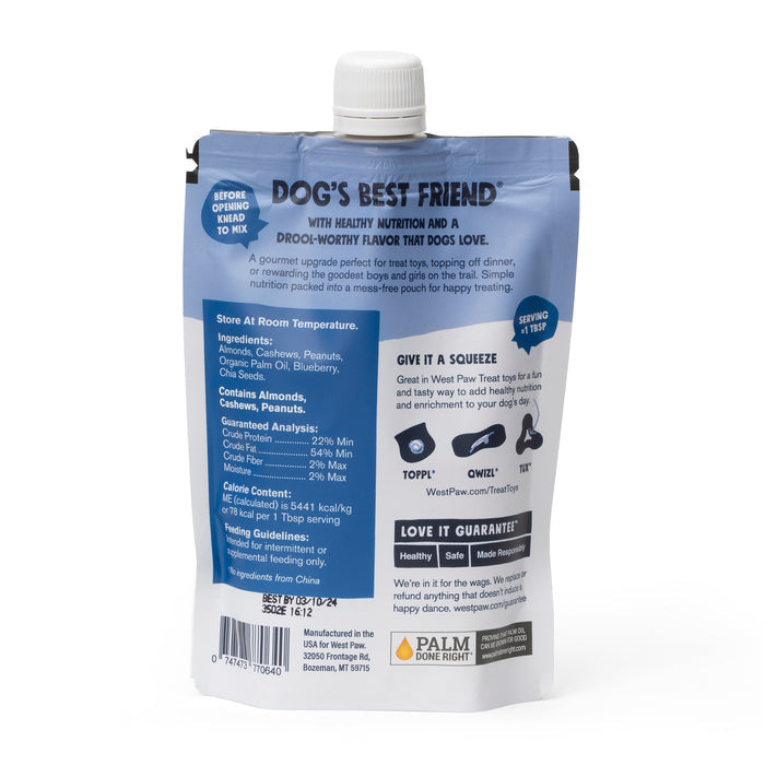 The Nut Butter Blueberry Creamy Dog Treat by West Paw is a blue and silver pouch offering plant-based nutrition. With ingredients like chicken, peanut butter, plus nutritional facts and feeding instructions, the pouch features a cap and the Palm Done Right logo for a healthy snack time.