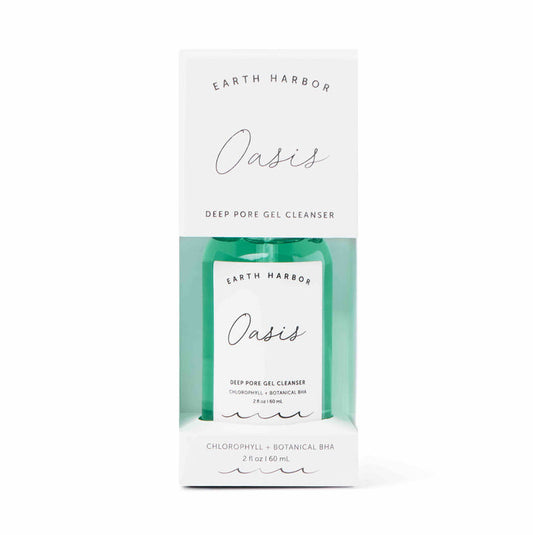 A 2 fl oz green bottle of Earth Harbors OASIS Deep Pore Gel Cleanser, spotlighting chlorophyll and botanical BHA for purifying, stands with its white box. Ideal for sensitive skin, it offers a refreshing cleanse.