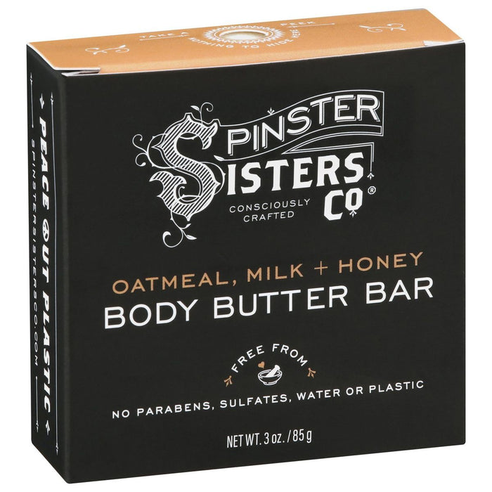 The Spinster Sisters Co. Oatmeal Milk & Honey Body Butter Bar comes in a sleek black box with white and brown text, emphasizing Peace Out Plastic. Its made with Fair Trade shea butter, offering rich vegan skincare without parabens, sulfates, water, or plastic. Net weight: 3 oz.