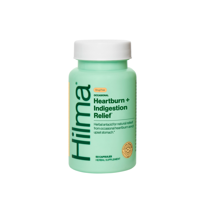 A mint green bottle of Hilma Occasional Heartburn + Indigestion Relief offers natural, drug-free solutions for digestive comfort and relief from heartburn and upset stomach, containing 50 herbal supplement capsules.