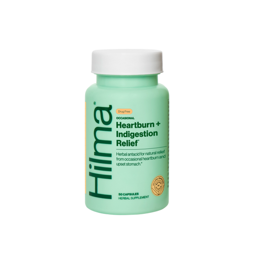 A mint green bottle of Hilma Occasional Heartburn + Indigestion Relief offers natural, drug-free solutions for digestive comfort and relief from heartburn and upset stomach, containing 50 herbal supplement capsules.