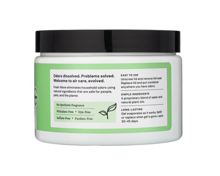 A jar with a white lid and green label from Fresh Wave reads: Odors dissolved. Problems solved. It highlights No Synthetic Fragrance, Phthalate-Free, Dye-Free, Sulfate-Free, and Paraben-Free using odor-absorbing gel and natural plant oils with instructions for ongoing odor control.