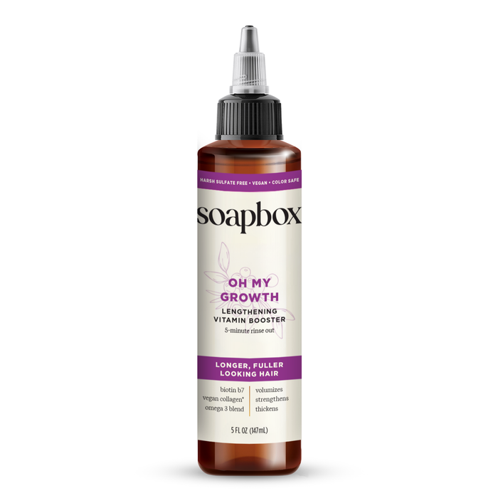 The Soapbox Oh My Growth Lengthening Vitamin Booster Rinse-Out Treatment bottle, with a purple band, offers biotin, vegan collagen, omega-3, and vitamins for longer and fuller hair. This perfect hair volumizer comes in a convenient 5 fl oz (147 ml) size.