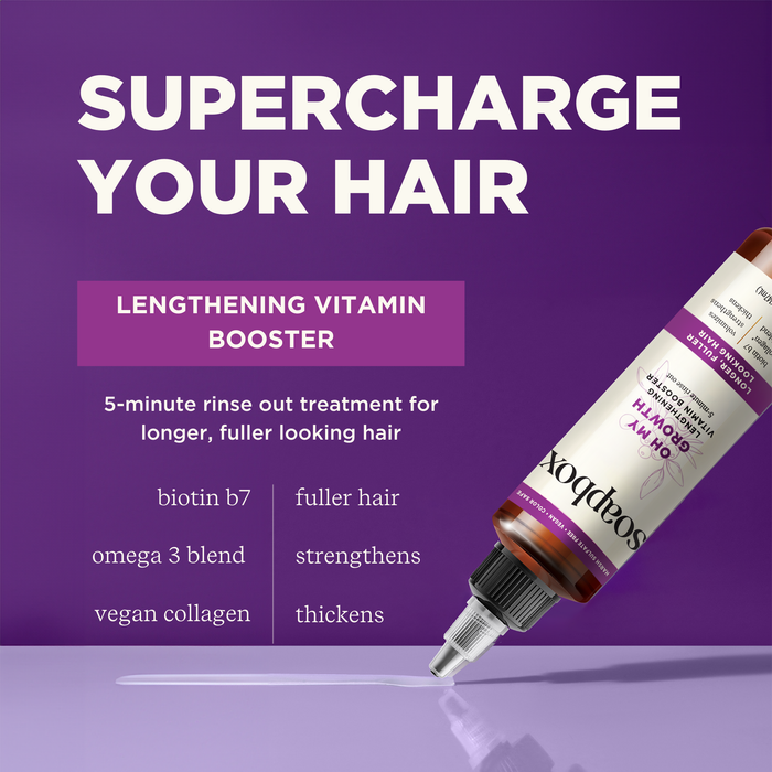 The Oh My Growth Lengthening Vitamin Booster Rinse-Out Treatment by Soapbox on a purple background promises fuller-looking hair. The text SUPERCHARGE YOUR HAIR highlights benefits like fuller hair, strengthens, and thickens. Key ingredients: biotin B7, omega 3 blend, vegan collagen.
