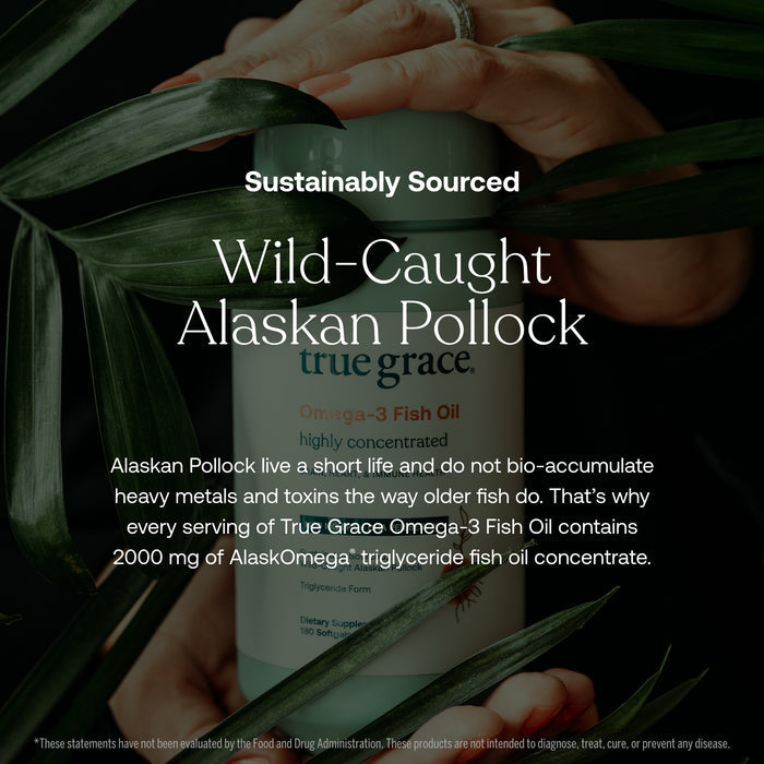 A hand holds a bottle of True Grace Omega-3 Fish Oil amid green leaves. The product is sustainably sourced from wild-caught Alaskan fish and delivers 2000 mg EPA & DHA-rich oil concentrate.