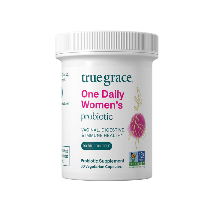 A white bottle labeled True Grace One Daily Womens Probiotic emphasizes benefits for vaginal, digestive, and immune health. It contains 30 vegetarian capsules with probiotics and features a Non-GMO Verified logo to ensure purity.