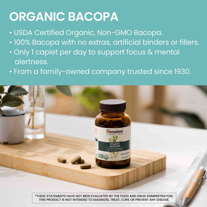 A bottle of Organic Bacopa dietary supplement from Himalaya is placed on a wooden cutting board. The image highlights the product's USDA Certified Organic, Non-GMO status, emphasizing its purity and benefits for focus and mental alertness. Text mentions the family-owned company's history since 1930.