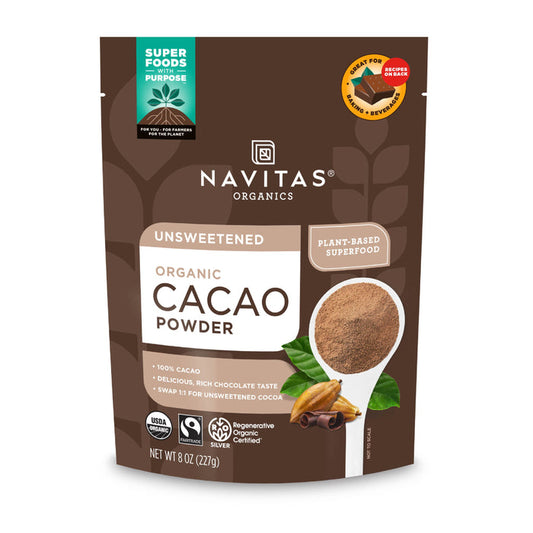 A brown Navitas Organics package of Organic Cacao Powder shows a spoonful of cacao powder, cacao beans, and a green Super Foods with Purpose label. With its rich chocolate taste, this plant-based product is organic, USDA certified, and nutrient-rich.