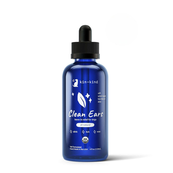 The Organic Clean Ears by kin+kind comes in a blue bottle with a dropper, providing an easy-to-use organic solution for dog ear care. This leave-in cleanser relieves odor, itch, and wax while featuring vet-formulated natural ingredients made in the USA.