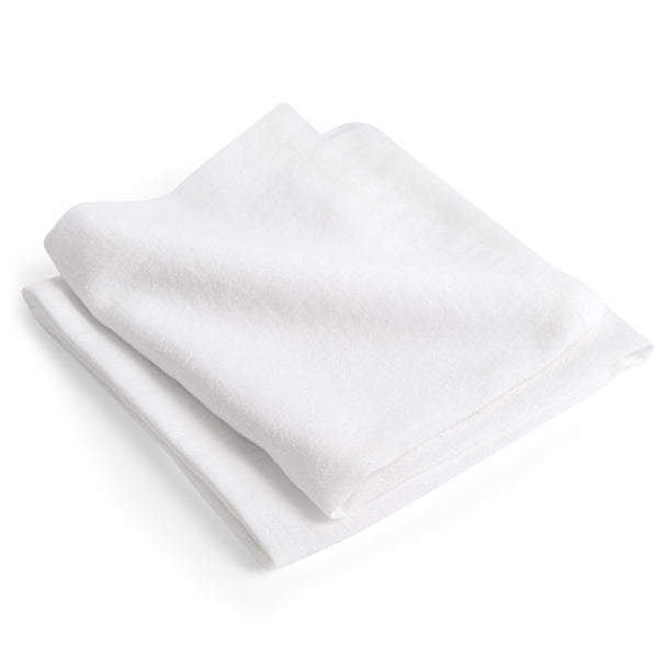 A neatly folded, soft white towel from Grove Co.s Organic Cotton Flour Sack Towels collection is displayed against a plain white background. The smooth edges and plush, clean fabric suggest comfort and freshness.