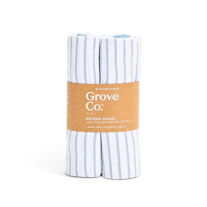 Two Organic Cotton Striped Kitchen Towels from Grove Co., featuring blue and white stripes, come in a brown paper band. Made of 100% organic cotton, they offer quick-drying properties and include details about size and packaging.