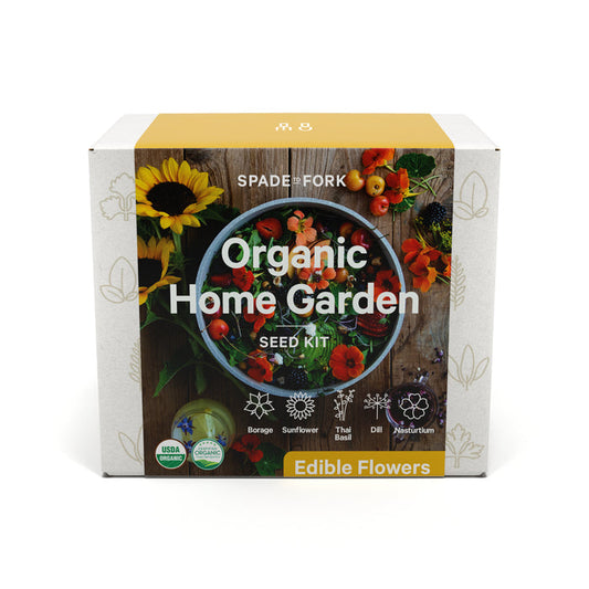 The Spade to Fork Organic Edible Flower Garden Kit is ideal for culinary herb enthusiasts, featuring sunflower and nasturtium imagery. It includes borage, sunflower, Thai basil, dill, and nasturtium seeds. USDA Organic and eco-friendly symbols are prominently highlighted.