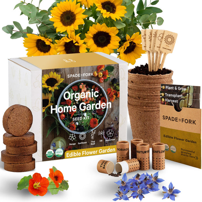 The Organic Edible Flower Garden Kit by Spade to Fork includes sunflower, nasturtium, and borage seeds. The kit features seed packets, peat pots, soil discs, and wooden plant markers in a box adorned with vibrant flower images.