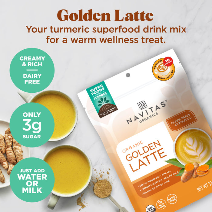 Packaging of Navitas Organics Golden Latte drink mix surrounded by two cups of creamy, yellow turmeric latte. Highlights include "Creamy &amp; Rich," "Dairy Free," "Only 3g Sugar," and "Just Add Water or Milk." Plant-based and supports wellness.