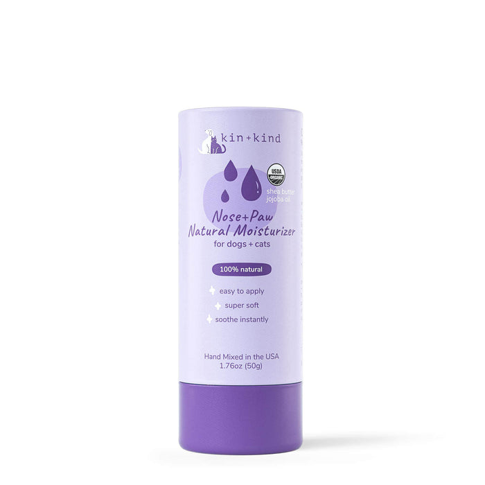 Organic Nose & Paw Moisturizer Stick by kin+kind comes in a 1.76oz purple cylindrical container. Its made in the USA for dogs and cats, featuring 100% natural ingredients, easy application, and instant soothing—ideal for pet grooming supplies.
