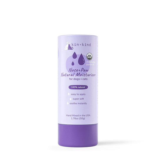 Organic Nose & Paw Moisturizer Stick by kin+kind comes in a 1.76oz purple cylindrical container. Its made in the USA for dogs and cats, featuring 100% natural ingredients, easy application, and instant soothing—ideal for pet grooming supplies.