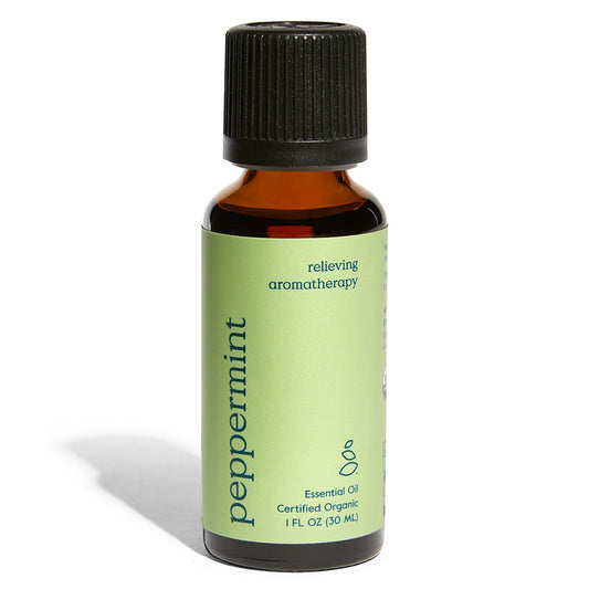 A small brown glass bottle from Grove Co. features a black cap and green label for Organic Peppermint Essential Oil - Relieving Aromatherapy. This certified organic 1 FL OZ (30 ML) bottle offers soothing home fragrance.