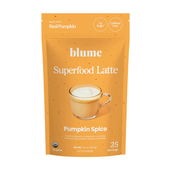 An orange bag labeled blume Organic Pumpkin Spice Latte Powder with a latte image. This superfood powder uses real organic pumpkin, has only 1g sugar, is caffeine free, and makes 25 servings.