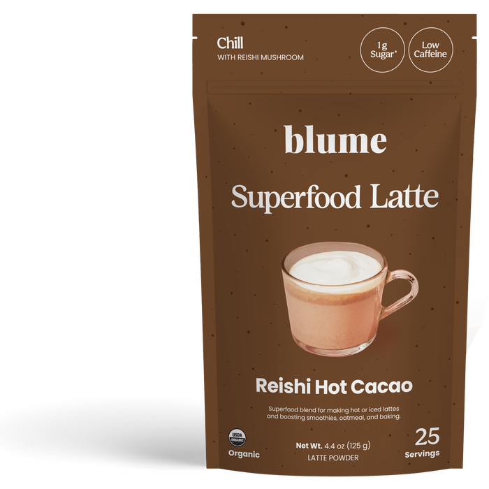 A brown pouch labeled blume Organic Reishi Hot Cacao Latte Powder with a frothy hot chocolate image. Highlights: adaptogen, organic ingredients, 1g sugar, low caffeine, and 25 servings per bag.